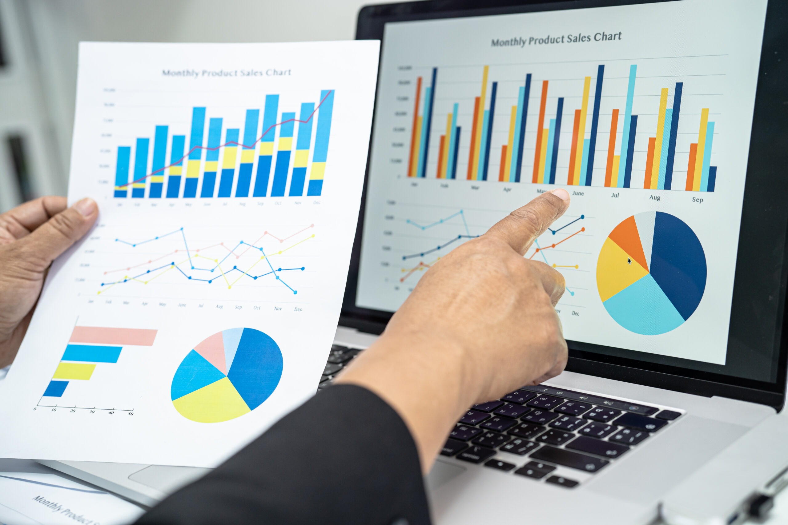 Asian accountant working and analyzing financial reports project